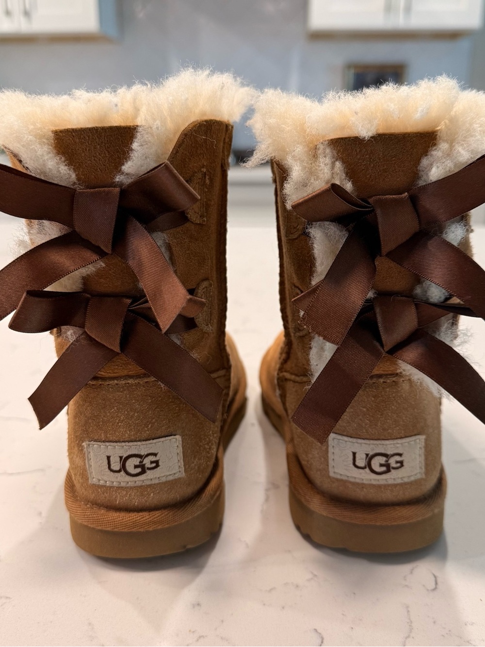 UGG Kids Cozy Faux-Shearling Brown Boots with Bows